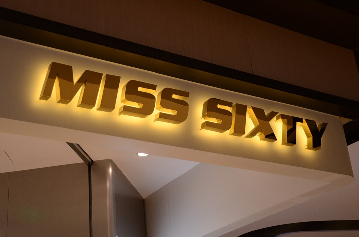 Classic backlit channel letters in gold plated steel with warm white halo