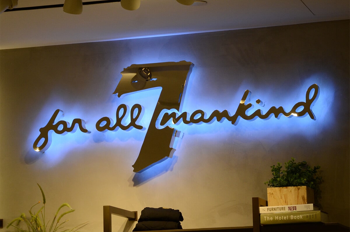 Classic backlit channel letter signs with polished steel and blue halo